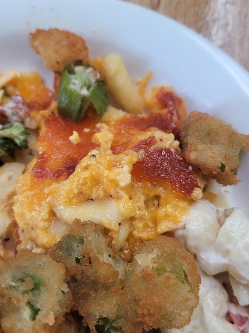 Assorted hot dishes on a restaurant buffet line.
