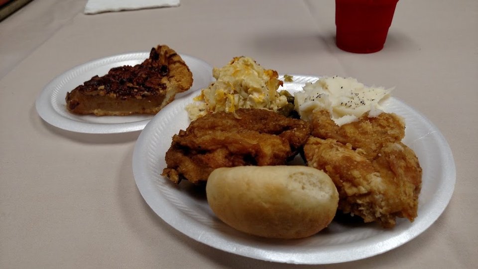 Assorted hot dishes on a restaurant buffet line.